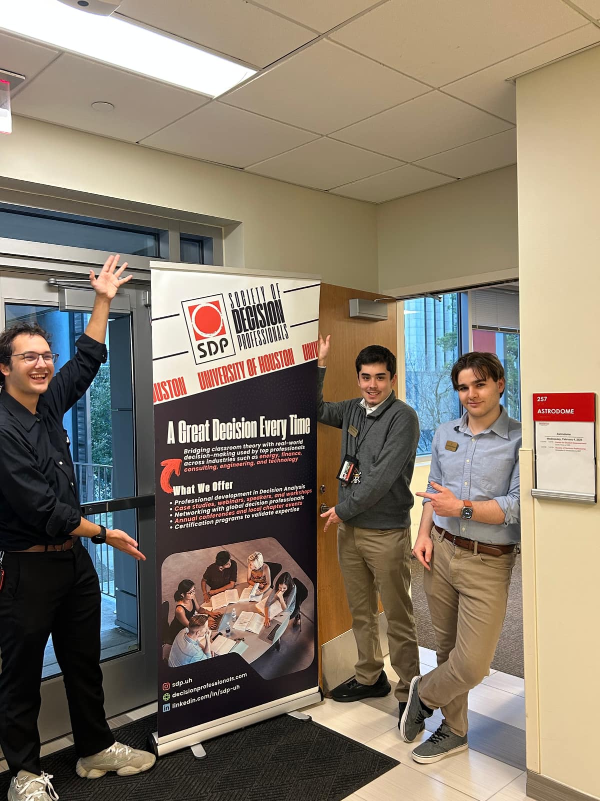 Officers with the SDP roll-up banner outside the meeting room